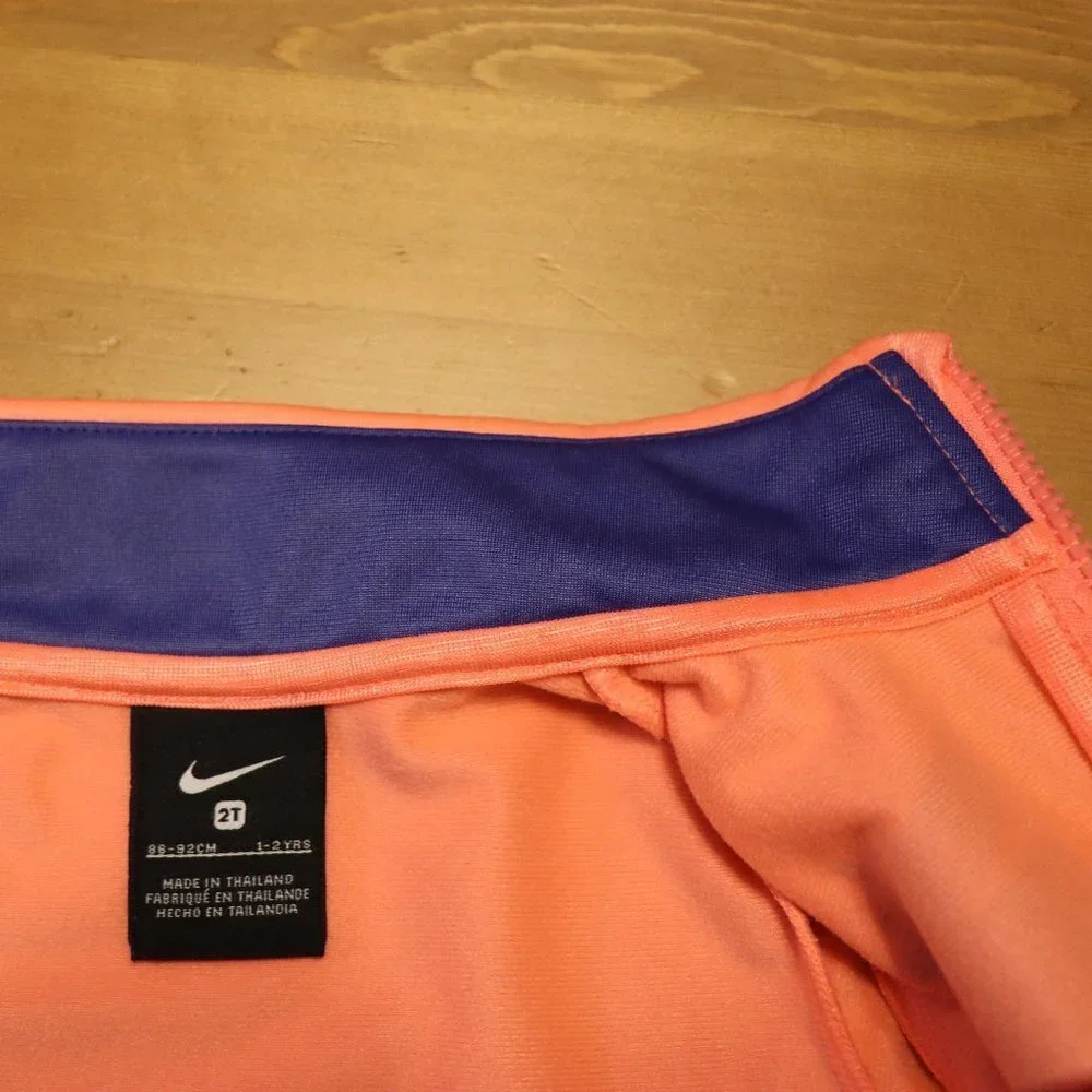 Nike Pink Zip-up Sweatshirt 2T, pink with blue writing & stars, ruffle bottom